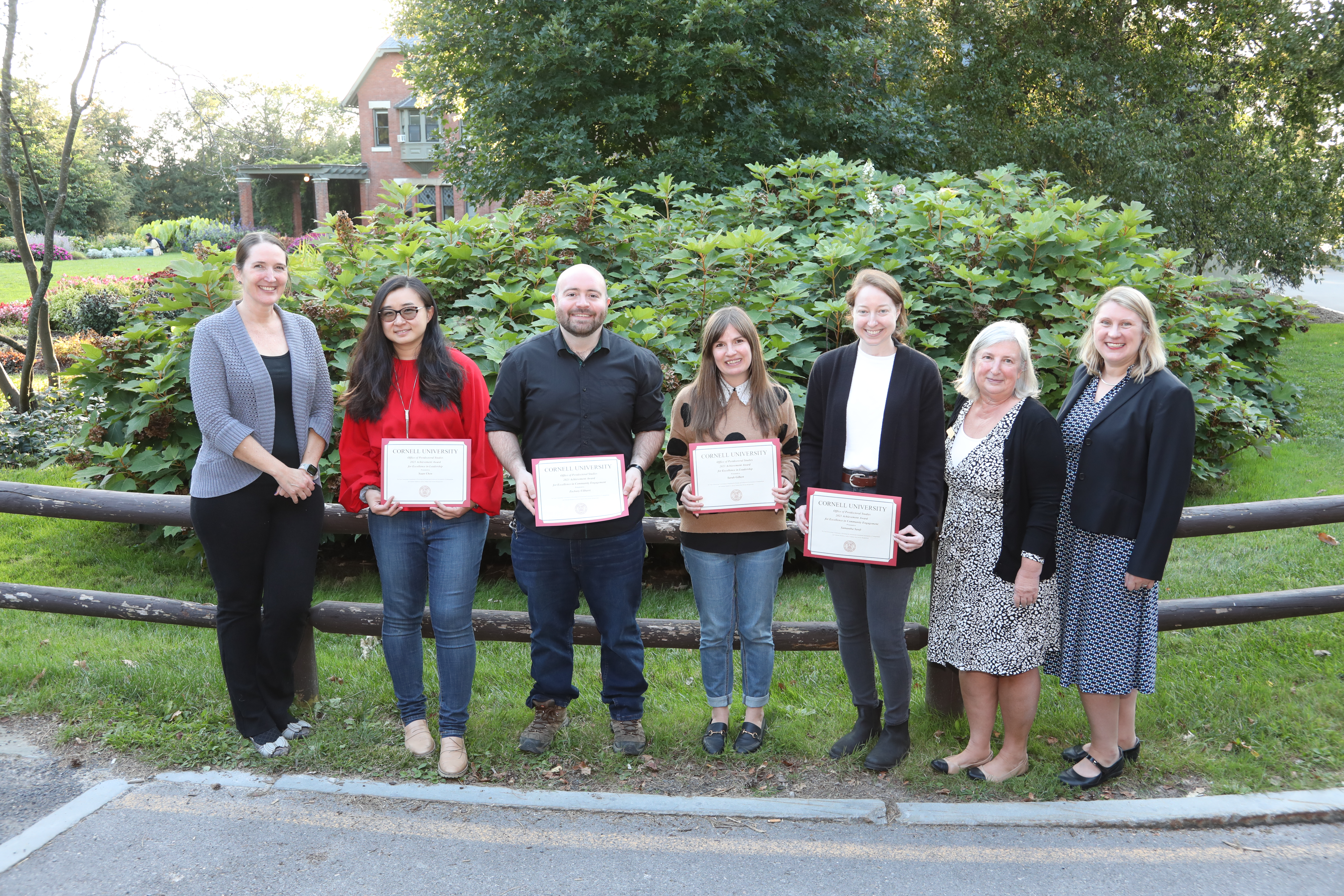 Four of six Postdoc Achievement Award recipients with Graduate School professional development team staff